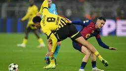 Berstatus tim tamu, Barcelona tampil dominan sejak menit awal pertandingan. (INA FASSBENDER/AFP)