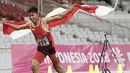 Purnomo Sapto Yogo pelari Indonesia meraih medali emas di nomor 100 meter putra klasifikasi T37 pada Asian Para Games 2018, di Stadion Utama Gelora Bung Karno Jakarta, Selasa (9/10/2018).  (Bola.com/Peksi Cahyo)