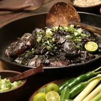 Ilustrasi cumi woku tinta./Copyright shutterstock.com/g/AriyaniTedjo