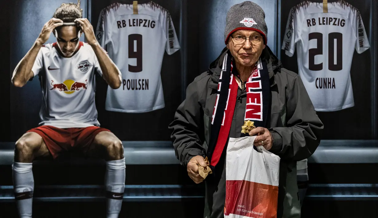 Leipzig fan in front of RB Leipzig advertising during the Bundesliga match between RB Leipzig and Borussia Mˆnchengladbach at Red Bull Arena on February 1, 2020 in Leipzig, Germany. (Photo by Boris Streubel/Bundesliga/Bundesliga Collection via Getty Images)