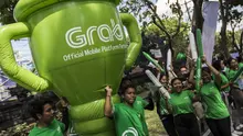 Sejumlah mitra dari Grab membawa balon raksasa saat pawai obor Asian Games XVIII di Denpasar, Bali, Selasa (24/7/2018). Sebanyak 53 kota di Indonesia akan dilalui oleh obor Asian Games. (Bola.com/Vitalis Yogi Trisna)