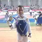 Keval Al Fadhil Hazi (10), bocah asal Palembang yang menorehkan prestasi dan mengantongi medali emas di event Kejuaraan Taekwondo Sumsel Open 2022 (Liputan6.com / Nefri Inge)