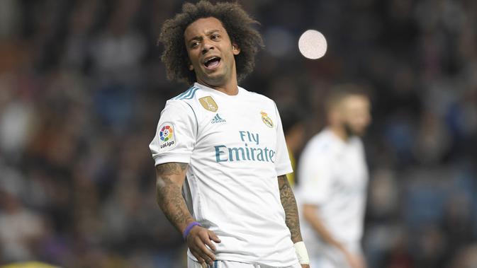 Bek asal Brasil, Marcelo mengikat kontrak bersama Real Madrid hingga 2020 dengan bayaran per pekan sebesar 100.000 pound sterling. (AFP/Gabriel Bouys)