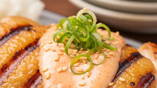 Ilustrasi ayam saus mentai (Image by Gemini AI)