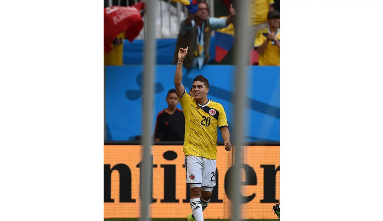 Gelandang Kolombia, Juan Fernando Quintero, merayakan golnya ke gawang Pantai Gading saat berlaga di penyisihan Piala Dunia 2014 Grup C di Stadion National Mane Garrincha, Brasil, (19/6/2014). (AFP PHOTO/Eitan Abramovich) 