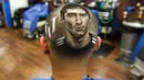 Inilah hasil lukisan wajah Lionel Messi yang dibuat Pemilik salon 'Rob the Original', Rob Ferrel, di San Antonio, Texas, (30/6/2014). (REUTERS/Ashley Landis)