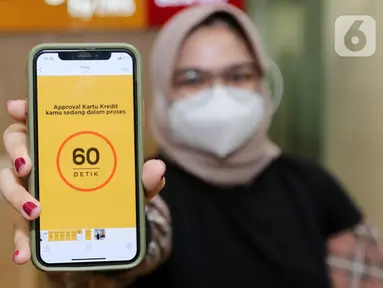 Model menunjukkan limit yang disetujui hanya dalam 60 detik pada peluncuran Kartu Kredit Digital digibank di perangkat handphone di Jakarta (16/09/2021). digibank by DBS menghadirkan Kartu Kredit Digital digibank sebagai kartu kredit digital pertama di Indonesia. (Liputan6.com/Fery Pradolo)