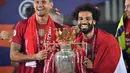 Kontribusi Mohamed Salah di lini serang sukses mengantarkan Liverpool mengakhiri puasa gelar Liga Inggris selama 30 tahun terakhir pada musim 2019/2020. The Reds berhasil mendulang 99 poin dan 19 gol diantaranya diciptakan oleh winger asal Mesir tersebut. (AFP/Paul Ellis)