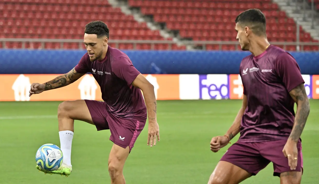 Manchester City dan Sevilla akan saling berhadapan dengan status sebagai juara di masing-masing kompetisi, pada pertandingan Piala Super Eropa. (Louisa GOULIAMAKI / AFP)