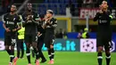 Pemain Liverpool Ryan Gravenberch, Ibrahima Konate dan Virgil van Dijk (kiri ke kanan) melakukan selebrasi usai memenangi matchday 1 League Phase Liga Champions 2024/2025 melawan AC Milan di Stadion San Siro, Milan, 17 September 2024. (PIERO CRUCIATTI/AFP)