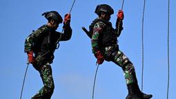 Tentara Nasional Indonesia (TNI) mengambil bagian dalam latihan keamanan untuk persiapan KTT G20 pada bulan November di Denpasar, Bali, Selasa (14/6/2022). (SONY TUMBELAKA/AFP)