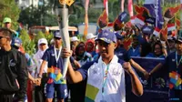 Salah satu Pembawa obor Asian Games 2018, Mohamad Yusuf, yang berprofesi sebagai penjual es krim (Inasgoc)