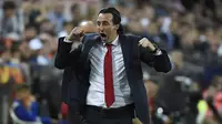 Unai Emery merayakan keberhasilan Arsenal setelah mengalahkan Valencia. (AFP/Jose Jordan)