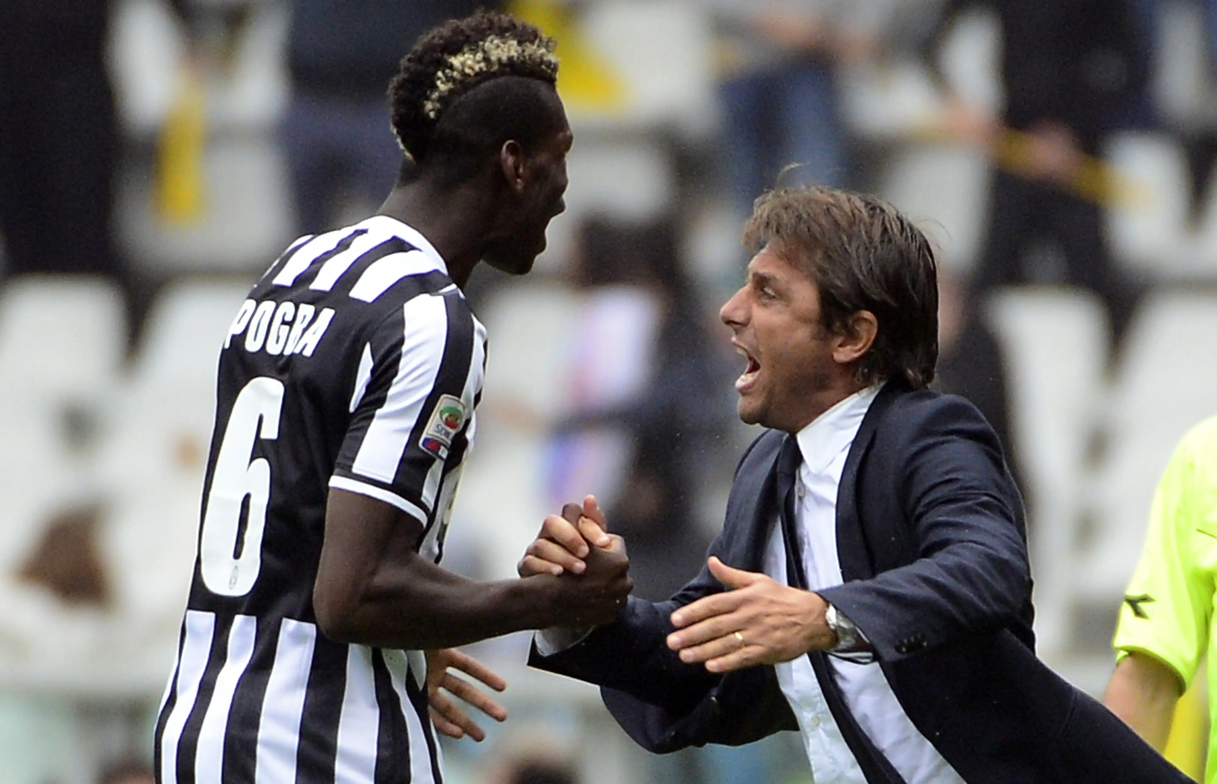 Paul Pogba dan Antonio Conte saat masih bekerja sama di Juventus. (OLIVIER MORIN / AFP)