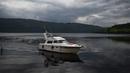 Kapal turis 'Nessie Hunter' melintas di perairan Loch Ness, Drumnadrochit, Skotlandia, 10 Juni 2018. Hasil dari penelitian para ilmuwan terkait monster raksasa Loch Ness di perairan tersebut menyimpulkan memang ada sesuatu di wilayah itu. (Andy Buchanan/AFP)