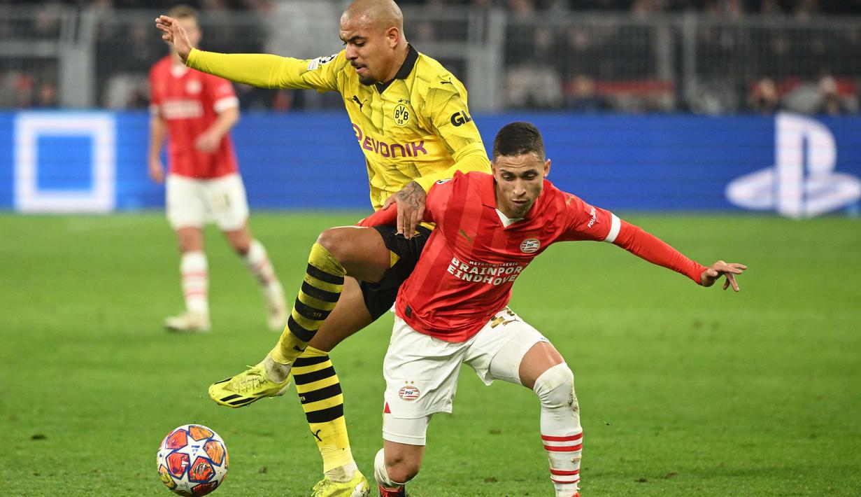 Hasilnya, pada menit ke-3 Jadon Sancho berhasil merobek gawang PSV Eindhoven. (INA FASSBENDER/AFP)