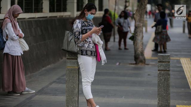 Udara Jakarta Buruk, Warga Beraktivitas Pakai Masker