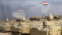 Tank-tank Mesir dikerahkan di dekat perbatasan Rafah utara Mesir yang berbatasan dengan Gaza, di tengah pertempuran yang terus berlanjut antara Israel dan kelompok militan Palestina, Hamas, Selasa (31/10/2023). (Khaled DESOUKI / AFP)