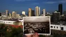 Sebuah gambar yang diambil pada 2 November 2015 menunjukkan pemandangan Beirut seperti yang diambil di kartu pos oleh fotografer tidak diketahui dan dipublikasikan sekitar tahun 1920-an. (AFP PHOTO / PATRICK BAZ)