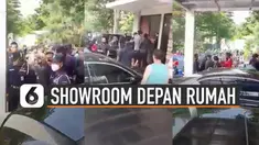 Beredar video warga perumahan buat showroom mobil di depan rumahnya. Kejadian itu membuat beberapa satpam mendatangi pemilik rumah tersebut.