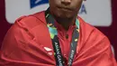 Lifter Indonesia, Suwoto Wijoyo, saat berlaga pada Asian Games di JIExpo, Jakarta, Senin, (20/8/2018). Suwoto Wijoyo berhasil menyumbang medali perunggu angkat besi putra kelas 56kg. (Bola.com/Vitalis Yogi Trisna)