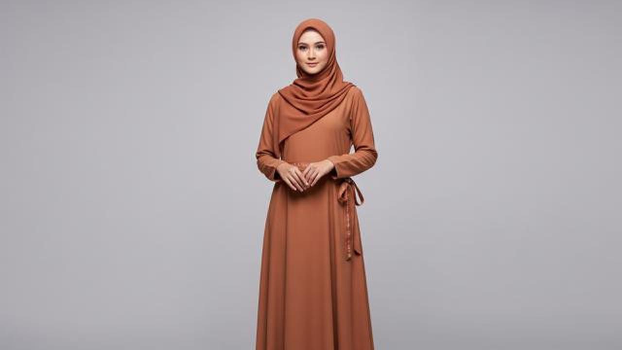 Gamis dengan Aksen Pita Samping/Ide Model Gamis Simple untuk Kelompok Pengajian (Sumber: gemini.com)