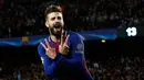 Pemain Barcelona Gerard Pique merayakan golnya saat melawan AS Roma pada pertandingan Liga Champions di stadion Camp Nou di Barcelona (4/3). Barcelona menang 4-1 ketika menjamu AS Roma. (AP Photo / Manu Fernandez)