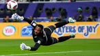 Kiper Oman Ibrahim Al-Mukhaini berusaha menyelamatkan bola saat melawan Arab Saudi pada pertandingan sepak bola Grup F Piala Asia di Khalifa International Stadium, Doha, Qatar, Selasa (16/1/2024). Arab Saudi mengalahkan Oman dengan skor 2-1. (AP Photo/Aijaz Rahi)