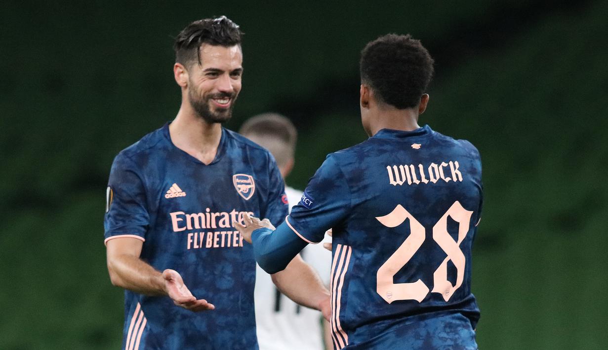 Gelandang Arsenal, Joe Willock, merayakan gol yang dicetaknya ke gawang Dundalk pada laga lanjutan Liga Europa 2020/2021 di Aviva Stadium, Jumat (11/12/2020) dini hari WIB. Arsenal menang 4-2 atas Dundalk. (AFP/Paul Faith)