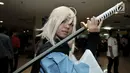 Cosplay berpose di Festival Ennichisai, Jakarta, Minggu (1/7). Festival ini dimeriahkan oleh para penggemar berkostum ala film animasi, komik, hingga karakter video game atau yang lebih dikenal dengan istilah Cosplay. (Merdeka.com/Iqbal S. Nugroho)