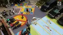 Penampakan mural di halaman depan Kantor Kelurahan Tegal Alur, Jakarta Barat, Rabu (18/4). Mural tersebut dibuat sebagai media informasi adanya Asian Games 2018. (Liputan6.com/Arya Manggala)