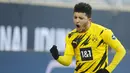 Gelandang Dortmund, Jadon Sancho melakukan selebrasi setelah mencetak gol ke gawang TSG 1899 Hoffenheim dalam pertandingan divisi satu Bundesliga di Dortmund, Jerman barat pada 13 Februari 2021.  Dortmund resmi melepas Sancho ke klub Inggris Manchester United. (AFP/Pool/Leon Kuegeler)