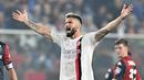 Pemain AC Milan, Olivier Giroud, saat melawan Genoa pada pekan ke-8 Serie A 2023/2024 di Stadion Luigi Ferraris, Minggu (8/10/2023). Kemenangan ini membawa AC Milan merebut puncak klasemen Serie A yang sebelumnya ditempati Inter Milan. (Tano Pecoraro/LaPresse via AP)