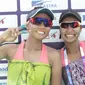 Pasangan pevoli pantai wanita Indonesia Desi Ratnasari dan Purari Eka Yokebed berpose usai bertanding melawan pasangan tim pevoli Timor Leste pada penyisihan pool C voli pantai Asian Games 2018 di Palembang, (20/8). (ANTARAFOTO/ INASGOC/Ful/Andi Rambe)