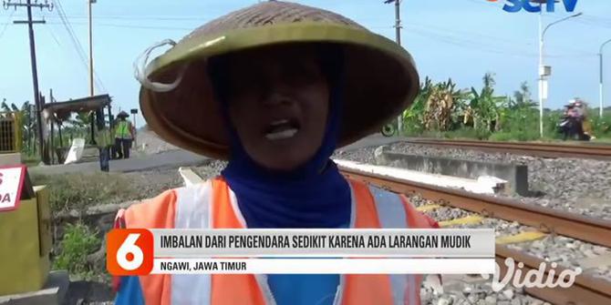 VIDEO :Satu Keluarga di Ngawi Rela Tidak Berlebaran Demi Menjaga Perlintasan Kereta Api