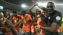 Pemain Pantai Gading melakukan selebrasi setelah mengalahkan Senegal saat babak 16 besar Piala Afrika 2023 di Stade Charles Konan Banny, Yamoussoukro, Selasa (30/01/2024) dini hari WIB. Pantai Gading menang dengan skor 5-4 pada babak adu penalti. (AFP/Kenzo Tribouillard)
