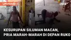 Seorang pria menunjukkan aksi mengerikan di depan sebuah ruko mengundang perhatian