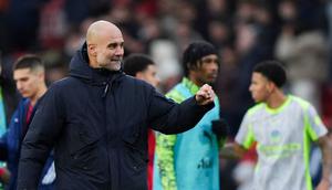 Pelatih Manchester City, Pep Guardiola, merayakan kemenangan atas Nottingham Forest pada laga pekan ke-18 Premier League di Stadion The City Ground, Sabtu (27/12/2025). (Joe Giddens/PA via AP)