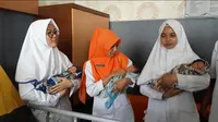 Bayi kembar tiga lahir dengan persalinan normal di Majenang Kabupaten Cilacap Jawa Tengah. (Foto: Liputan6.com/Muhamad Ridlo)