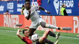 Vinicius Junior tampil impresif dengan mencetak dua gol untuk Los Blancos. (Ander Gillenea/AFP)