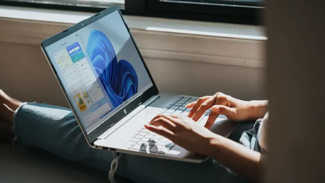 Person working on Windows 11 computer