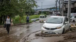 Hujan deras yang melanda wilayah tengah Jepang menyebabkan banjir dan tanah longsor. Satu orang dikabarkan tewas. (Yuichi YAMAZAKI/AFP)