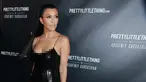 Kourtney Kardashian berpose saat menghadiri peluncuran PrettyLittleThing By Kourtney Kardashian di Los Angeles, California (25/10). Model 38 tahun ini tampil seksi dengan balutan gaun hitam super ketat. (Rich Fury/Getty Images/AFP)