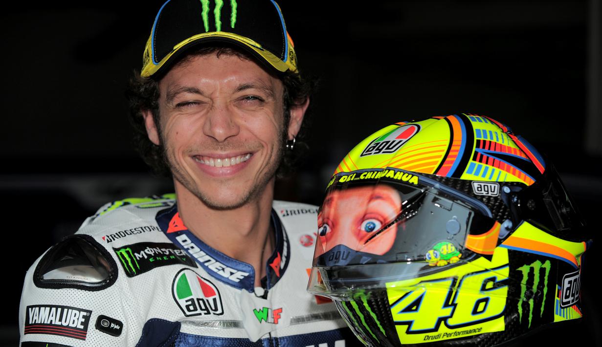Rossi dengan helm bergambar dirinya tahun 2014. (AFP/Mohd Rasfan)