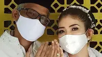 Fira Basuki resmi mengikat janji suci pernikahan dengan Nico Hermanu di tengah pandemi pada Sabtu, 18 April 2020. (dok. Instagram @firabasuki/https://www.instagram.com/p/B_HpJxBl3eK/Putu Elmira)