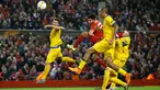 Gelandang Liverpool, Emre Can (kedua kiri) menyundul bola ke arah gawang Sion pada Liga Europa di Stadion Anfield, Jumat (2/10/2015). Liverpool bermain imbang dengan Sion dengan skor 1-1. (Reuters/John Sibley)