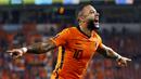 Memphis Depay menjadi pemuncak klasemen sementara top skor kualifikasi Piala Dunia 2022 zona Eropa. Penyerang andalan Barcelona tersebut telah mengoleksi tujuh gol dan tiga assist dari enam kali penampilannya bersama Die Oranje. (Foto: ANP/AFP/Maurice Van Steen)