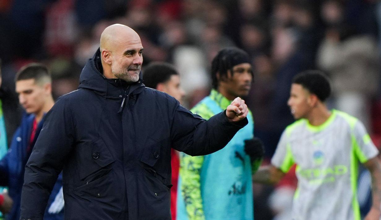 Pelatih Manchester City, Pep Guardiola, merayakan kemenangan atas Nottingham Forest pada laga pekan ke-18 Premier League di Stadion The City Ground, Sabtu (27/12/2025). (Joe Giddens/PA via AP)