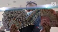 Rupiah Ditutup Dekati 18.000 per Dolar AS