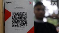 Dengan QRIS, pelanggan dapat membayar langsung menggunakan dompet digital yang terhubung dengan kode QR yang dihasilkan oleh pedagang atau penyedia jasa. (Liputan6.com/Johan Tallo)